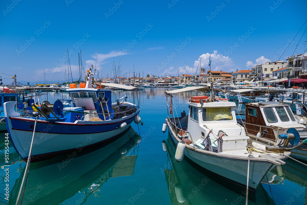 The small fishing boats in the harbor.