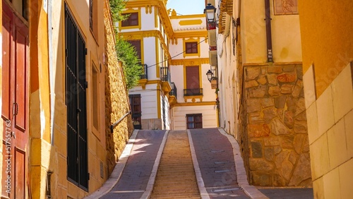 Casco antiguo y coloridas casas en calles estrechas de la población de Polop de la Marina en Alicante junto a Benidorm. photo