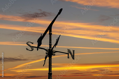 Weather Vane Against Sunset Sky