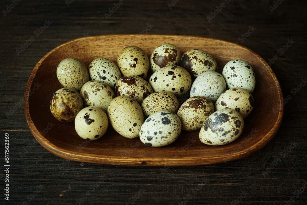 Fresh quail eggs close up on a wooden table small hard boiled eggs rustic top view Fresh quail eggs close up on a wooden table small hard boiled eggs rustic top view