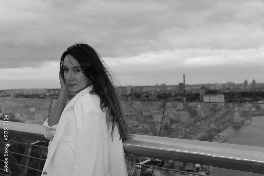 Long haired woman against the Kyiv city landscape in black and white
