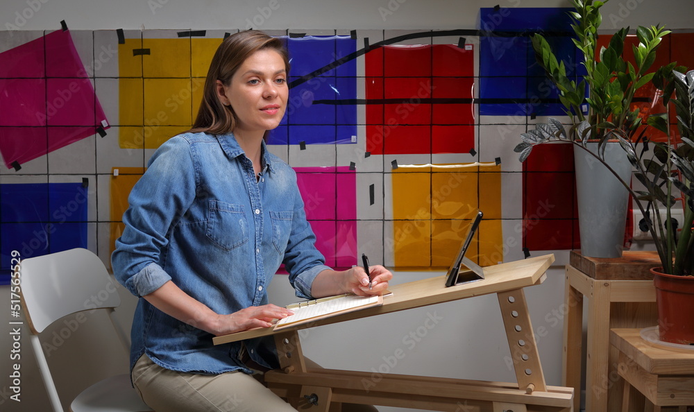 Designer woman working at home with color palette