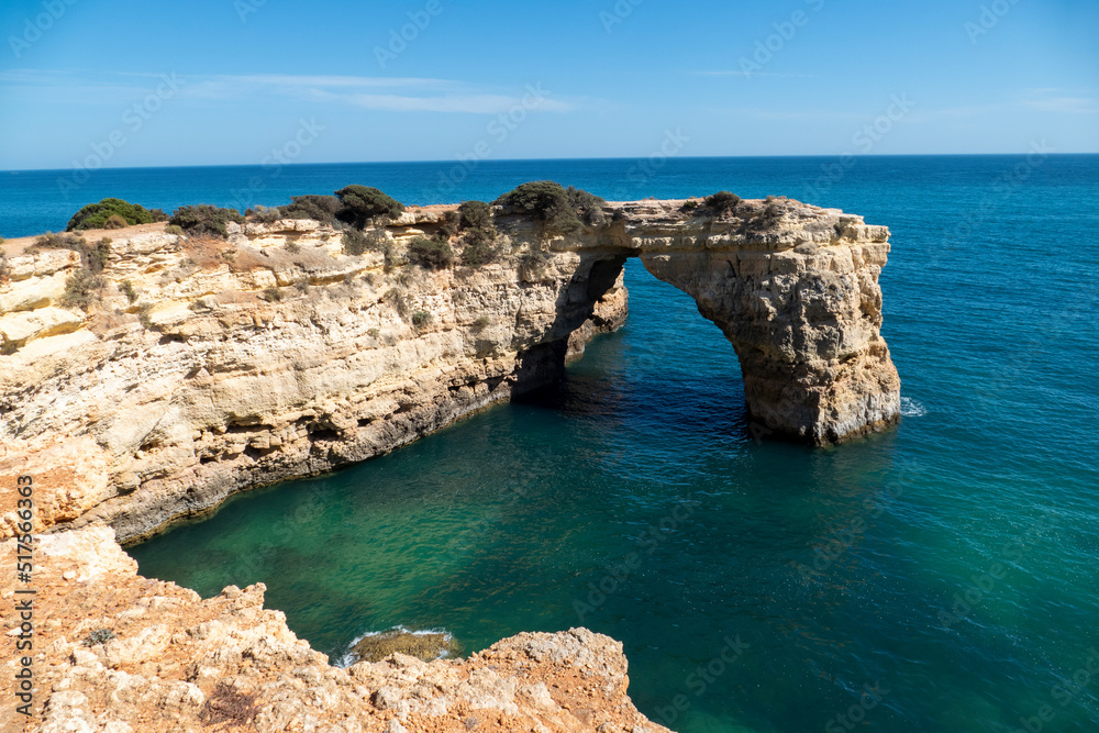 Natural Arch of Albandeira during low tide. Landmark in Lagoa, Algarve.