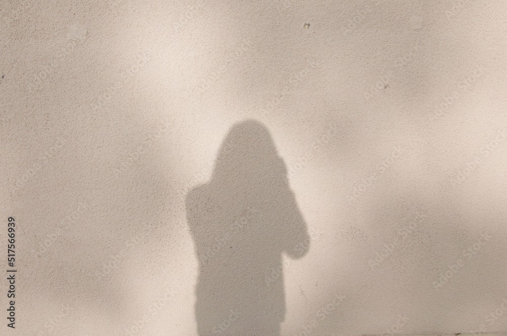 shadow on wall of man with camera shadow on wall of man with camera