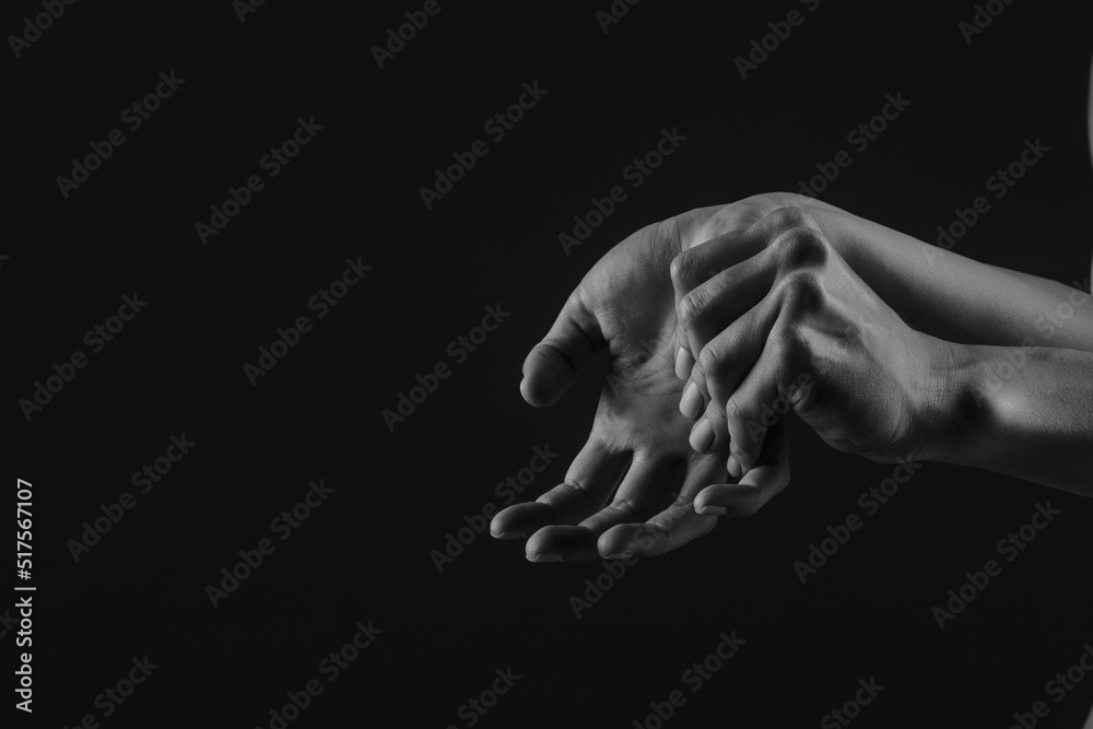 close-up hand massage on a dark background