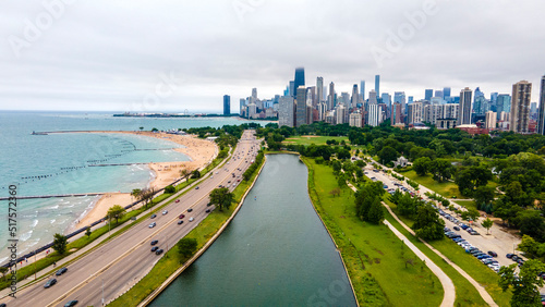 establishing aerial drone footage of a Chicago neighborhood downtown. the city beautiful architectural is also covered by lush green trees throughout creating a welcoming view for tourist © ezellhphotography