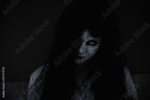 Fotografia Asian woman ghost or zombie horror creepy scary close up she face and hair cover