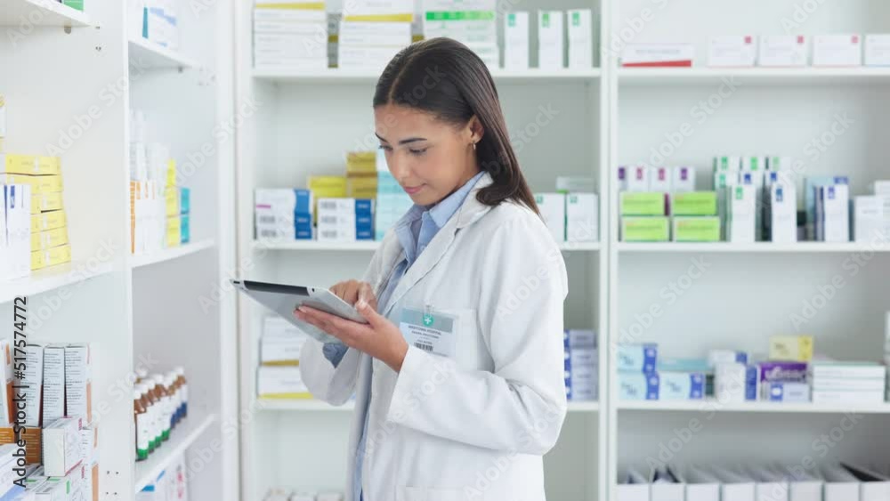 A young female pharmacist stocktaking in a dispensary using a tablet. Doctor preparing prescriptions and medication at clinic or pharmacy. Healthcare professional sorting medicine with digital device A young female pharmacist stocktaking in a dispensary using a tablet. Doctor preparing prescriptions and medication at clinic or pharmacy. Healthcare professional sorting medicine with digital device