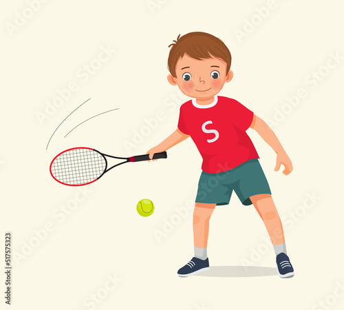 cute little boy athlete play tennis at sport club holding tennis racket ready to hit the ball