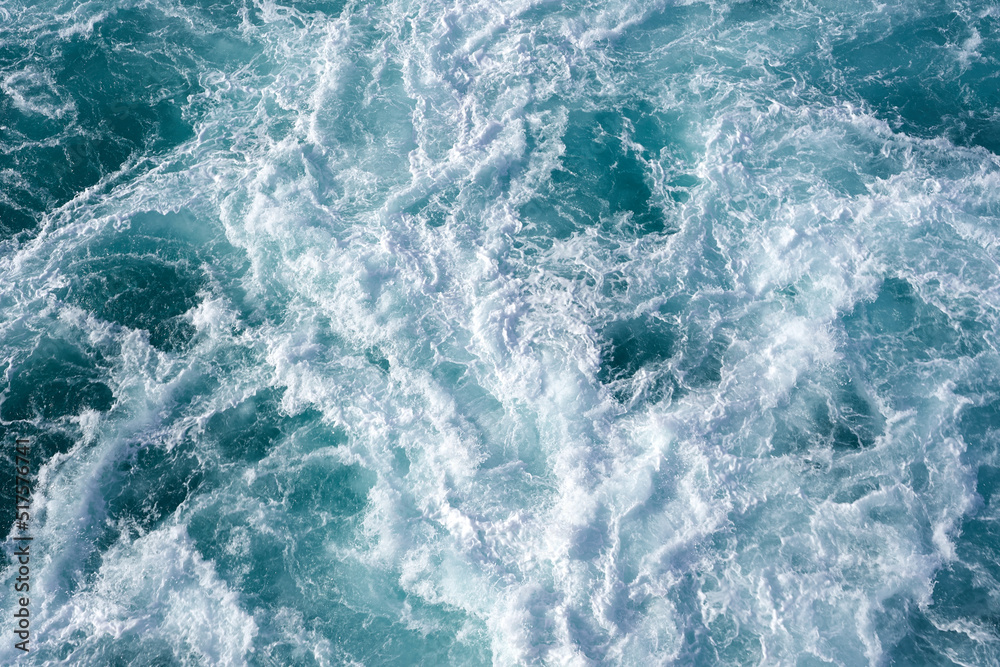 Water abstract background. Cruise ship wake while leaving the pier in Hawaii 