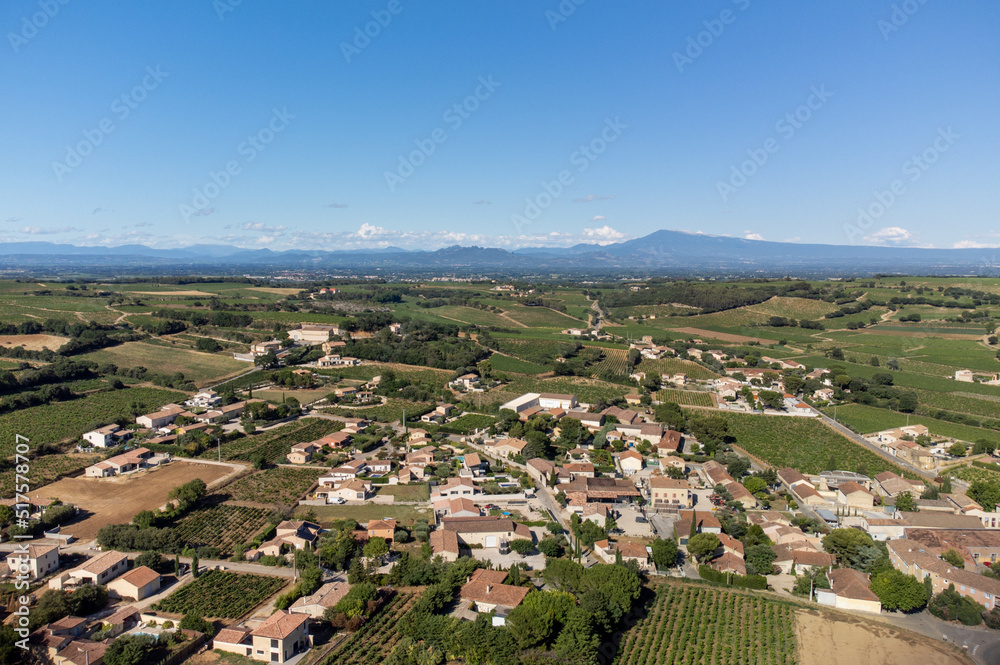 Aerial vIew on medieval buildings and vineyards in sunny day, vacation destination wine making village Chateauneuf-du-pape in Provence, France