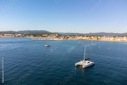 Aerial view on Gulf of Saint-Tropez, sail boats, houses of Port Grimaud and Port Cogolin, summer vacation in Provence, France © barmalini