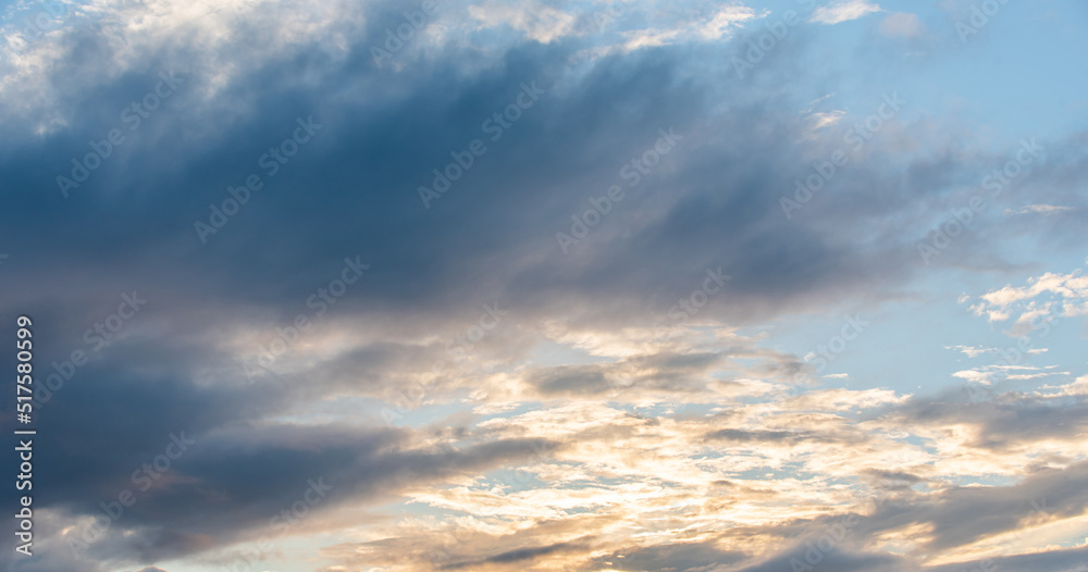 dark blue sunset sky with rain clouds.