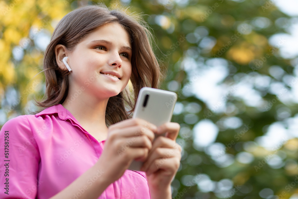 Overjoyed pretty girl wears in pink get carry away with music. Asian teenager girl use smartphone and enjoy favorite playlist via stereo headphones, relaxed sings along with carefree expression. High Overjoyed pretty girl wears in pink get carry away with music. Asian teenager girl use smartphone and enjoy favorite playlist via stereo headphones, relaxed sings along with carefree expression. High