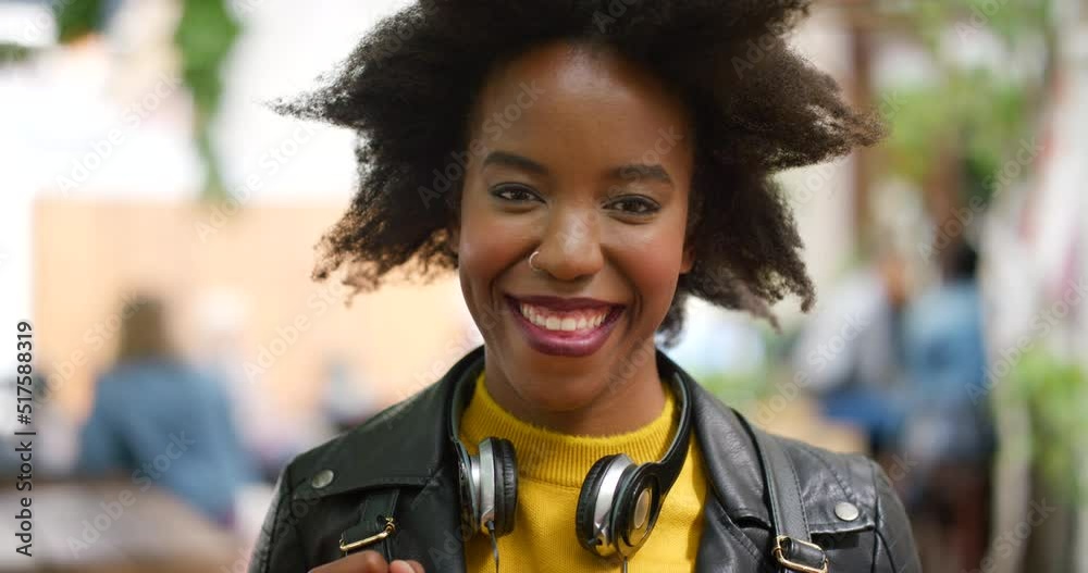 Beautiful and confident black woman with an afro smiling outdoors in the city. Portrait of an edgy and stylish young African student standing outside on campus. A happy and trendy lady in a park Beautiful and confident black woman with an afro smiling outdoors in the city. Portrait of an edgy and stylish young African student standing outside on campus. A happy and trendy lady in a park