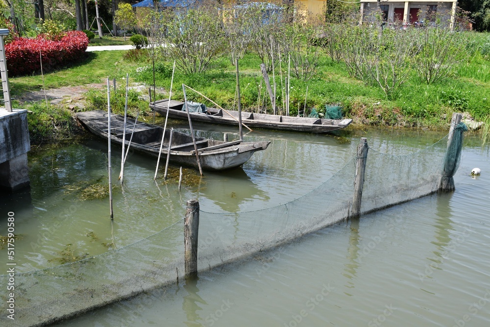 two old fishing boats moored on the shore