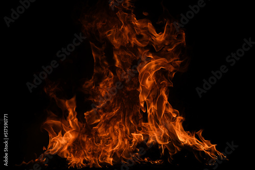 Fire blaze flames on black background. Fire burn flame isolated, abstract texture. Flaming explosion with burning effect. Fire wallpaper, abstract art pattern with copy space.