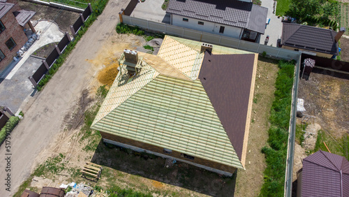 Roofing Contractors Installing House Roof Board for Asphalt Shingles. Roofing Construction. Roof Repair.