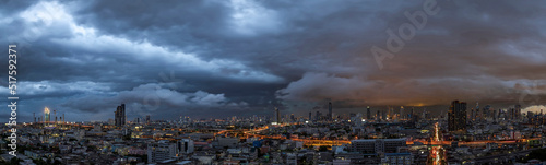 Menacing storm above Bangkok city life background