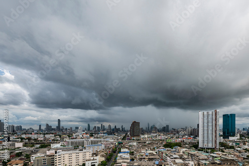 Menacing storm above Bangkok city life background © Waraphorn Aphai