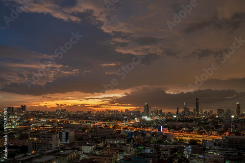 Menacing storm above Bangkok city life in twilight time background