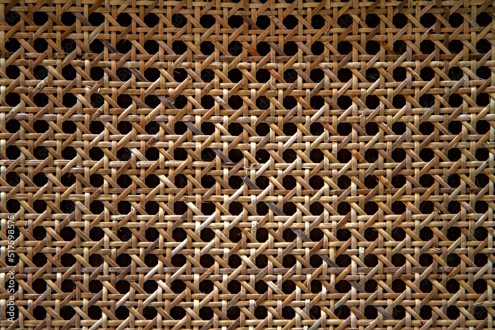 Woven bamboo strips close-up patterned bamboo rattan texture background. Woven bamboo strips close-up patterned bamboo rattan texture background.