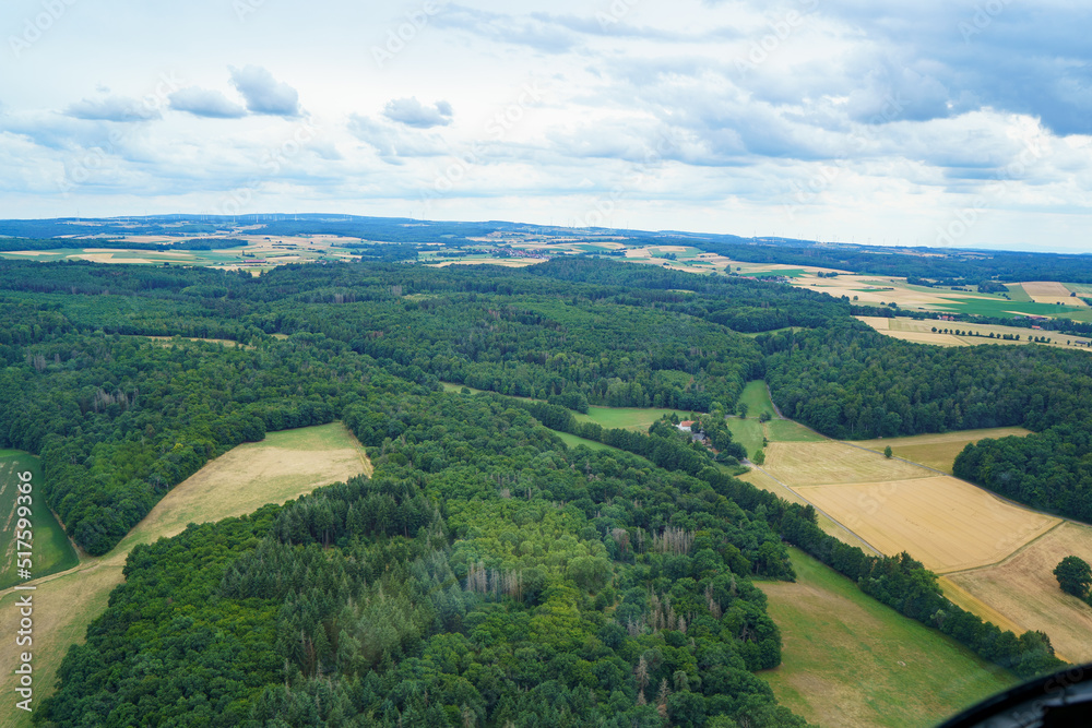 Landscape in Germany in summer from above. Top view. Nature, forests, fields.