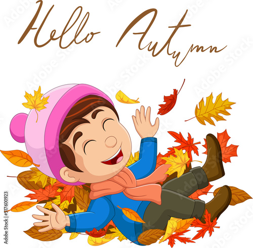 Cartoon happy little boy with autumn leaves