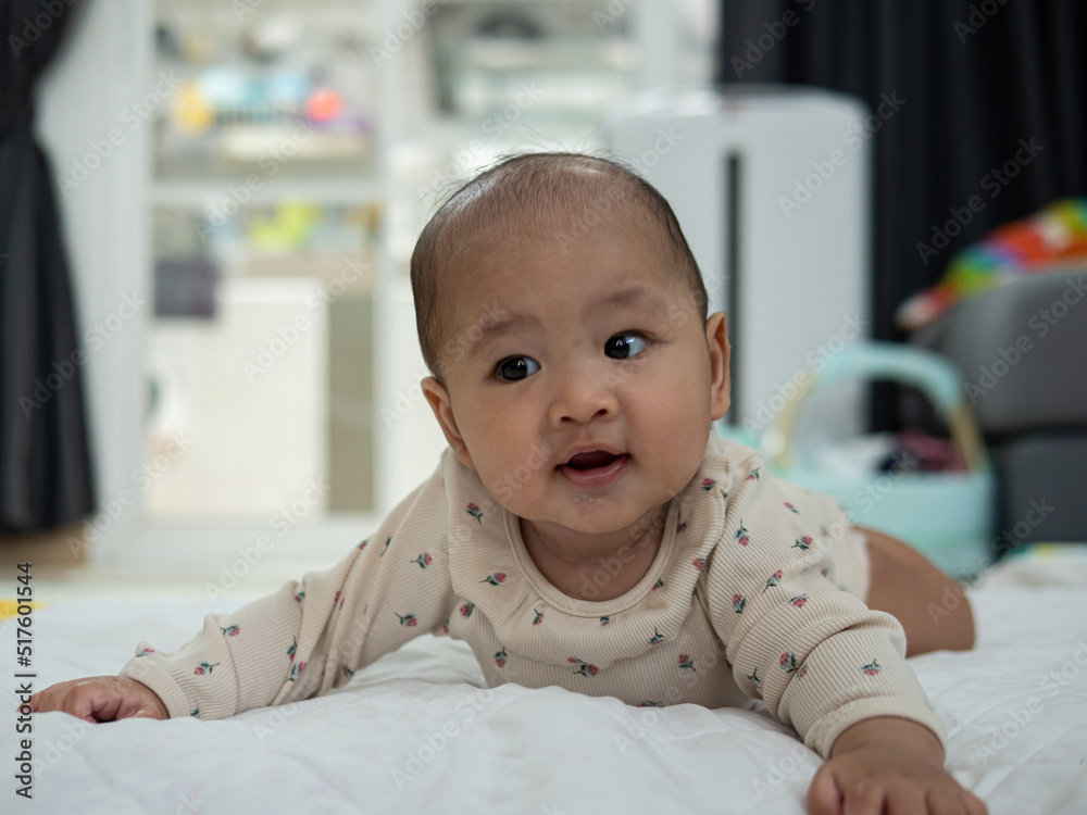 Portrait of a crawling baby on the bed Portrait of a crawling baby on the bed
