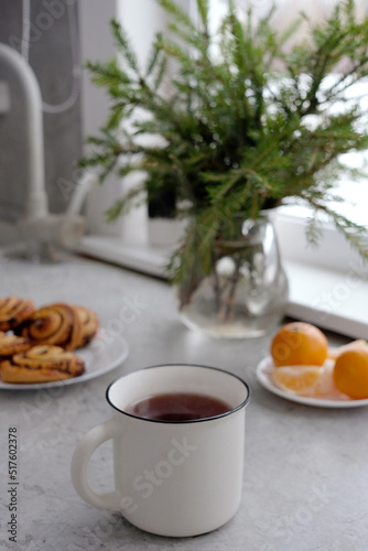 christmas holidays food - tea cup, tangerine and poppy seed buns