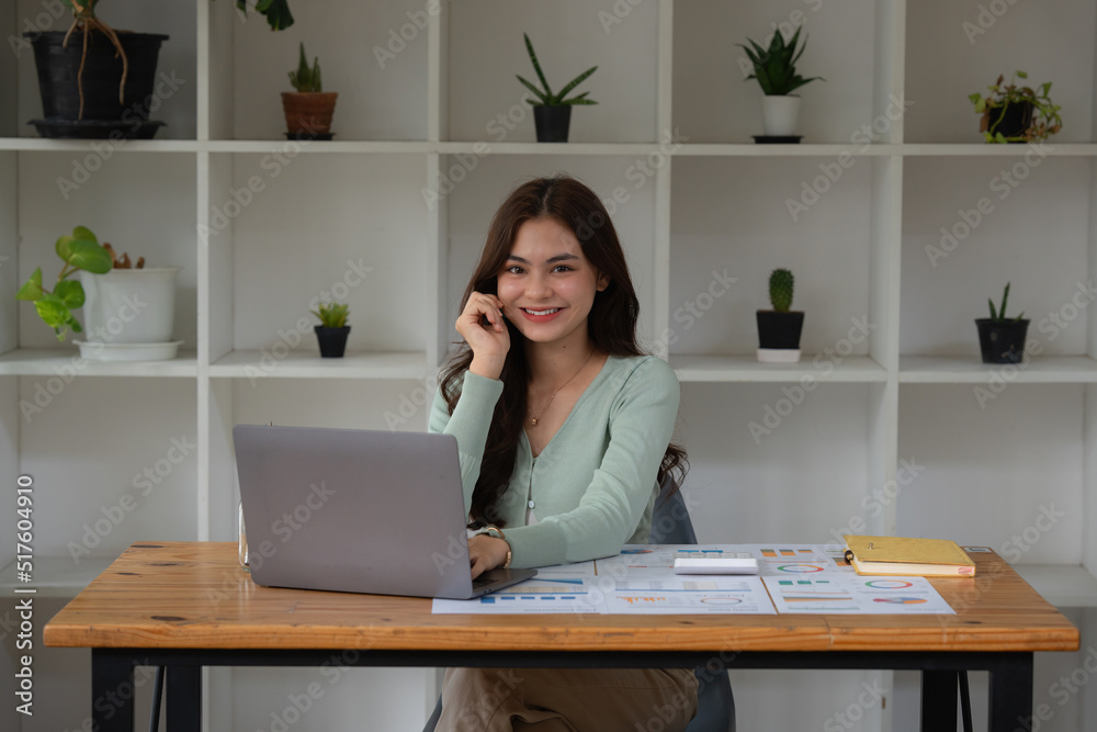 Consult financial concept. Business woman pointing at paperwork and using calculator on desk at office. back to office. Consult financial concept. Business woman pointing at paperwork and using calculator on desk at office. back to office.