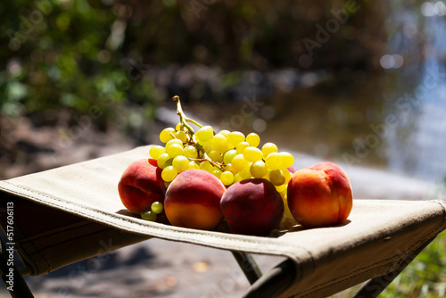 Fototapeta Naklejka Na Ścianę i Meble -  Peaches and grapes outdoors
