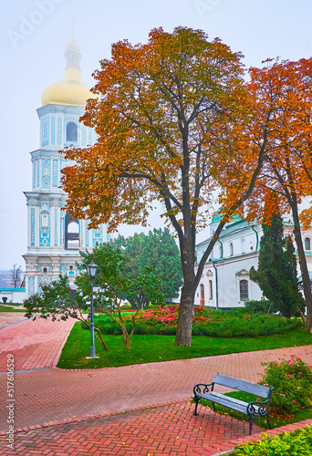 The red horse-chestnut trees and foggy Bell Tower of St Sophia Cathedral, Kyiv, Ukraine photo