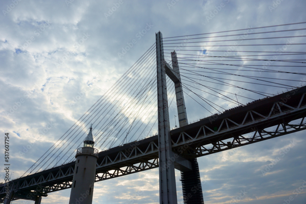 View of bridge against cloudy sky. Impressive Yokohama bay bridge over Tokyo Bay View of bridge against cloudy sky. Impressive Yokohama bay bridge over Tokyo Bay