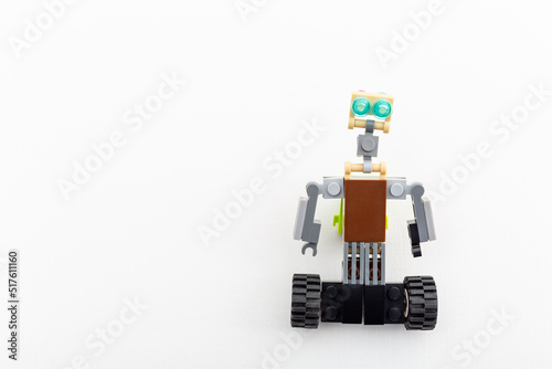 Robot made from the children's designer, details of plastic constructor block. DIY educational toy. Practice in robotics. The development of the imagination. Entertainment. A game of building objects.
