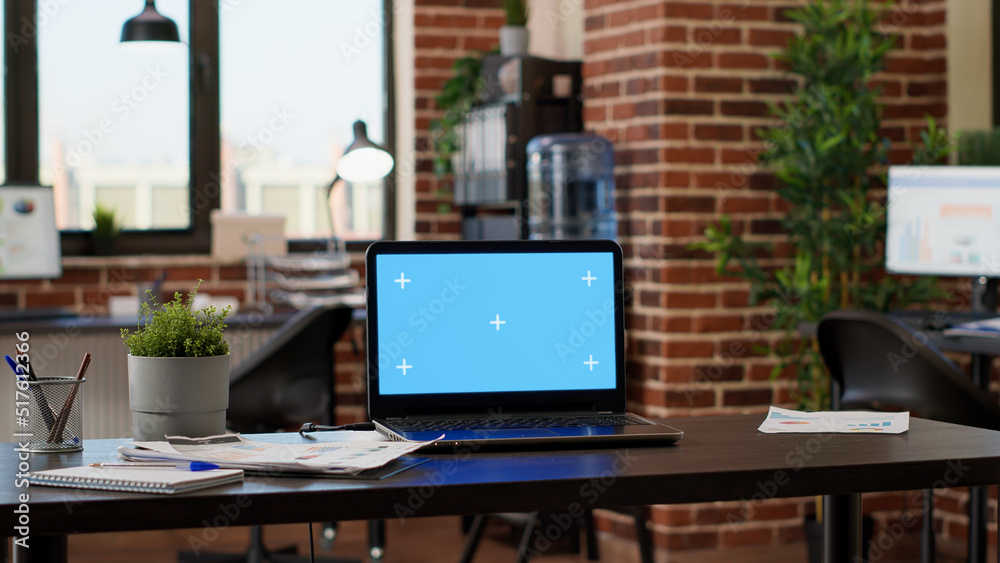 Nobody in company office with greenscreen template on laptop, empty workplace with blank mockup background. Computer display with isolated chroma key and copyspace on desktop. Nobody in company office with greenscreen template on laptop, empty workplace with blank mockup background. Computer display with isolated chroma key and copyspace on desktop.