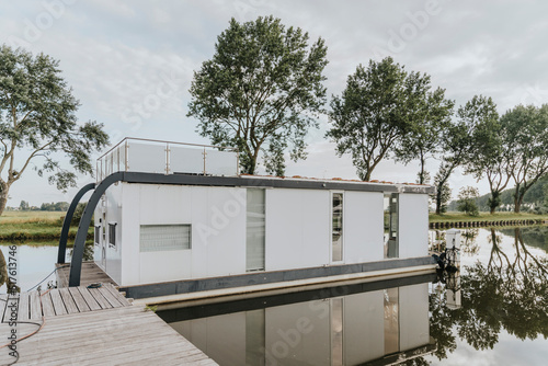 Houseboat with reflection on Yser River photo