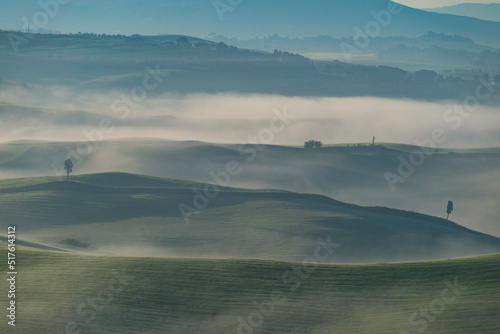 Italy, Tuscany, Volterra, Rolling landscape on foggy morning