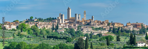 Italy, Tuscany, San Gimignano, Panoramic view of medieval town in summer photo
