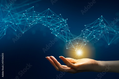 Woman hand touching Digital transformation conceptual for next generation technology era, Abstract futuristic technology with polygonal shapes on dark blue background.