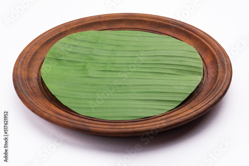 banana leaf on blank plate for edit food or subject on