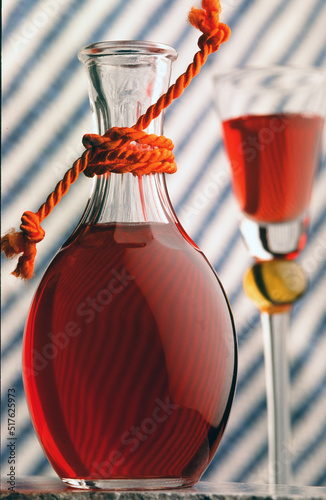 decanter and goblet with red wine © gal