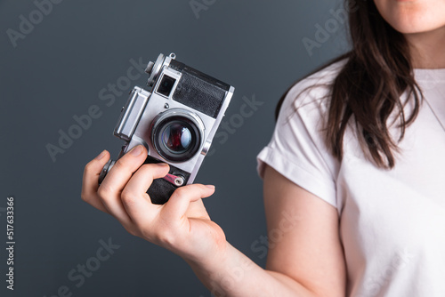 woman holding vintage camera