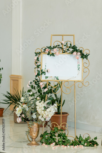 Obraz na płótnie Engagement or wedding floral gold coloured welcome board and easel in banquet hall w salonie