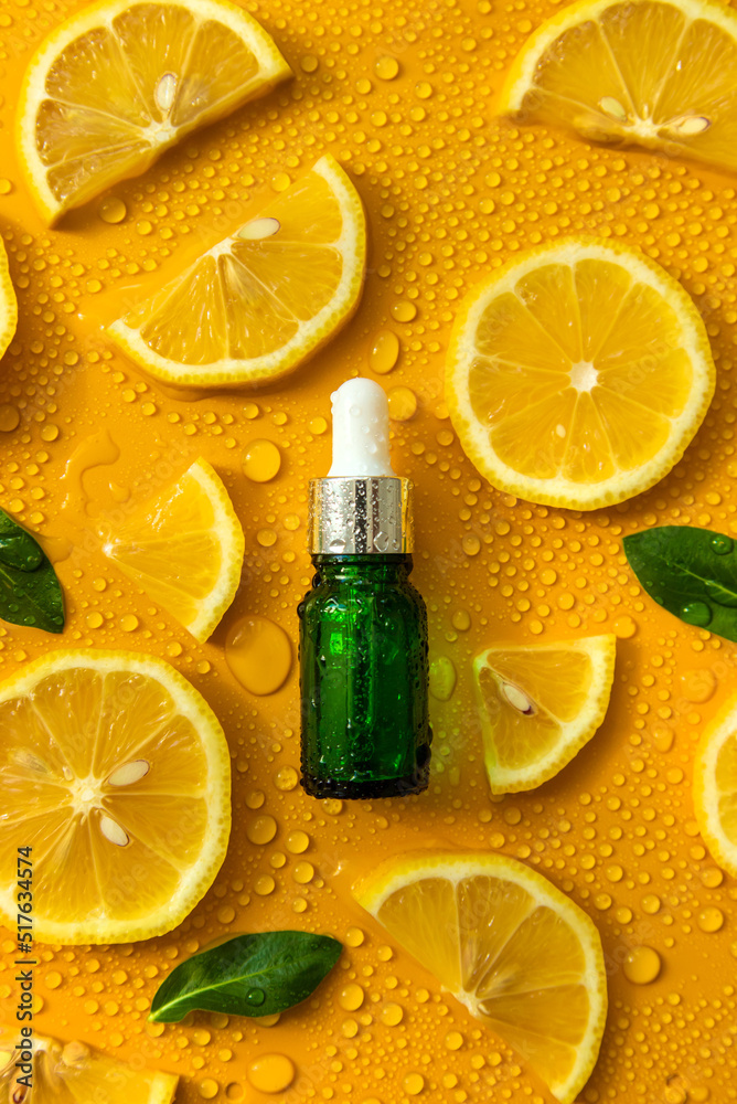 Bottle of cosmetics and drops of liquid, moisturizing lemon. Hyaluronic acid. Selective focus. Bottle of cosmetics and drops of liquid, moisturizing lemon. Hyaluronic acid. Selective focus.