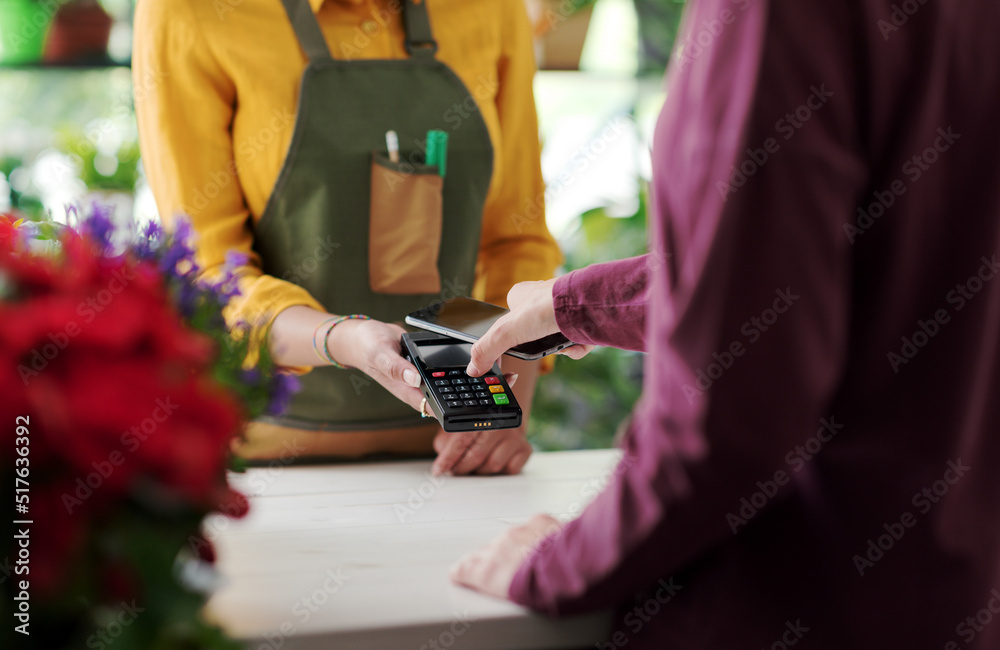 Customer paying using her smartphone