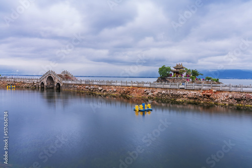 Natural landscape of small island temples and ancient stone arch bridges on Erhai Lake in Yunnan Province, China