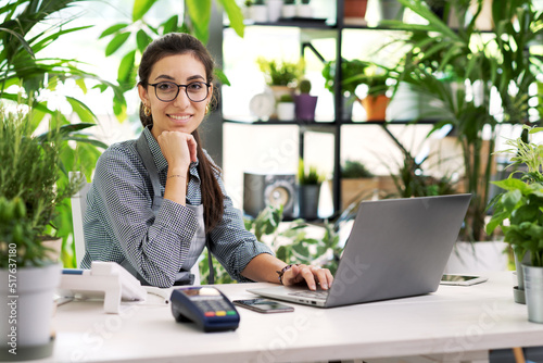 Professional florist working in her shop