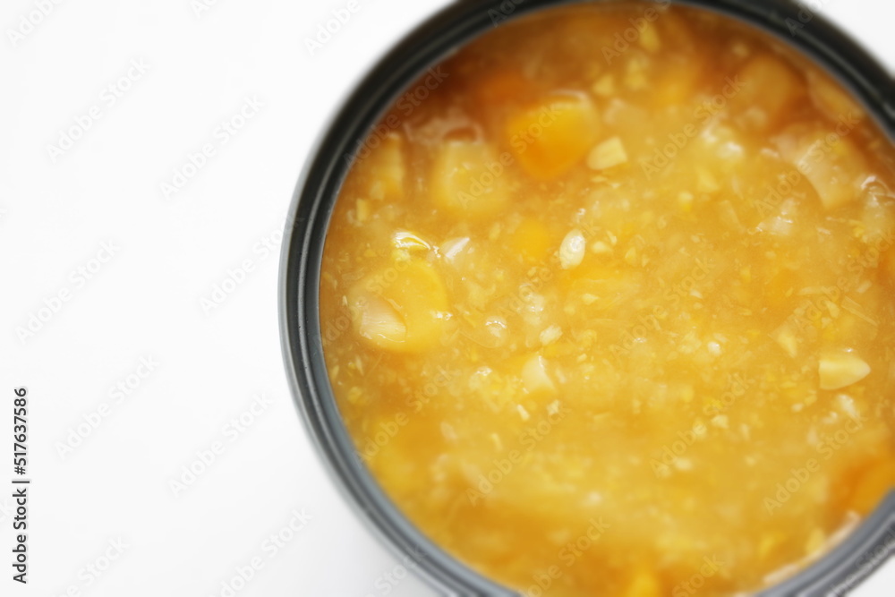 Canned food ingredient, sweetcorn cream in can with copy space shot from overhead Canned food ingredient, sweetcorn cream in can with copy space shot from overhead