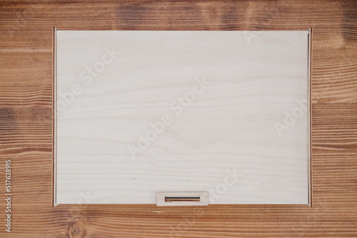 Wooden empty box on wooden background. Top view.